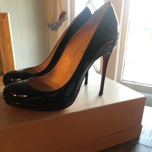 Black patent leather Louboutin heels, red bottom is repaired